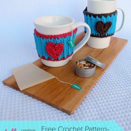 Looking for a simple crochet project that's perfect for a beginner crocheter? How cute is this free crochet pattern for a DIY Heart Mug Cozy. This would make a cute and easy handmade gift idea or a great wedding favor.