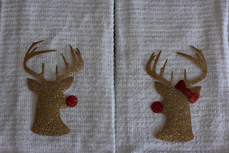 DIY Mr. & Mrs Rudolph Hand Towels from Sew Creative made on the Cricut Explore make the perfect Christmas Hostess Gift. Vinyl laid on towels ready to be ironed on