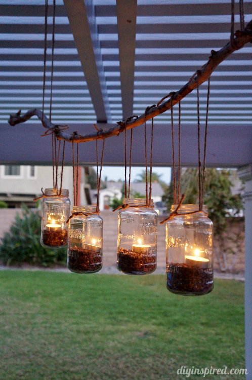 This easy DIY mason jar chandelier project is simple and uses supplies you probably have around the house. It would be beautiful for an outdoor wedding or a backyard party.