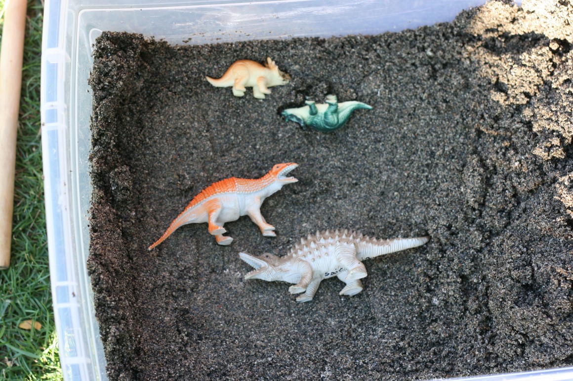 Make your own dinosaur excavation sensory bin. Perfect for palaeontologists to be