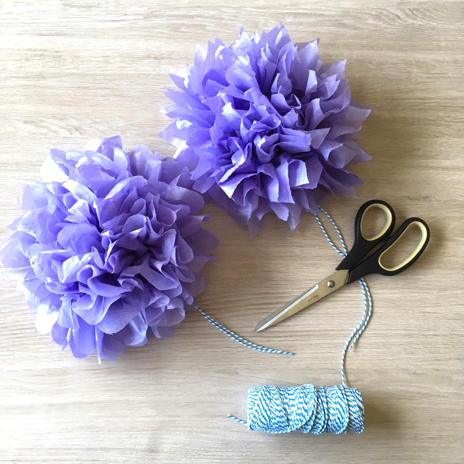 Looking for a budget party decoration idea? Learn how to make 8 DIY mini tissue paper flowers for $1.00! With step by step photos and instructions this post is a 