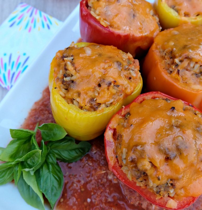 A quick and easy 30 minute weeknight meal idea! Italian Stuffed Bell Peppers Recipe with Rice, Ground Beef and Veggies! Parents will love it's packed full of hidden vegetables and kids will love the taste!