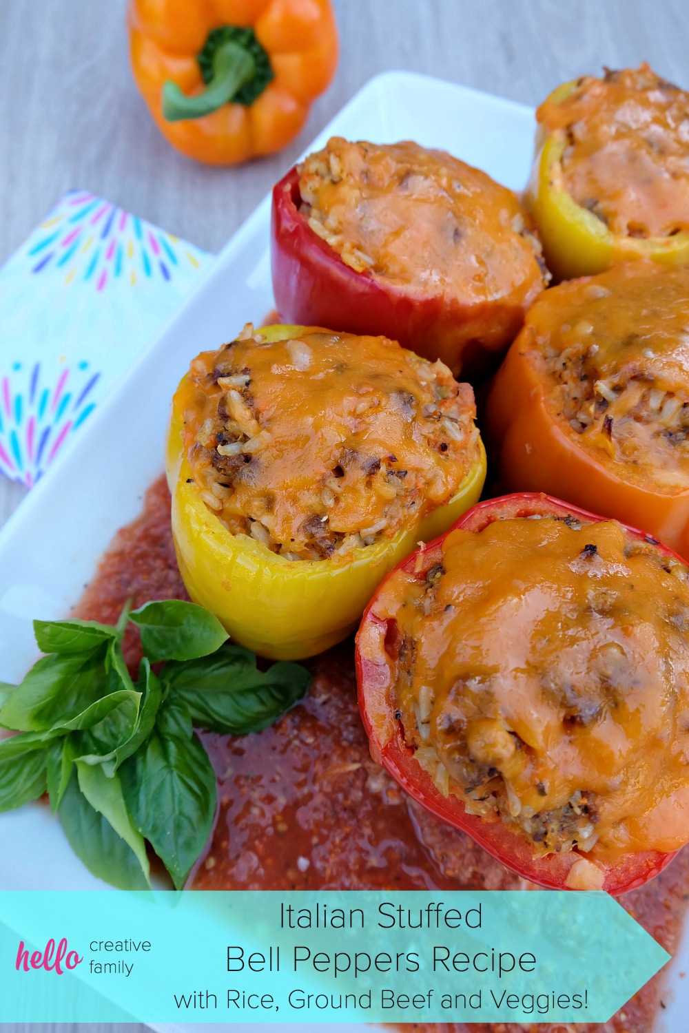 A quick and easy 30 minute weeknight meal idea! Italian Stuffed Bell Peppers Recipe with Rice, Ground Beef and Veggies! Parents will love it's packed full of hidden vegetables and kids will love the taste!