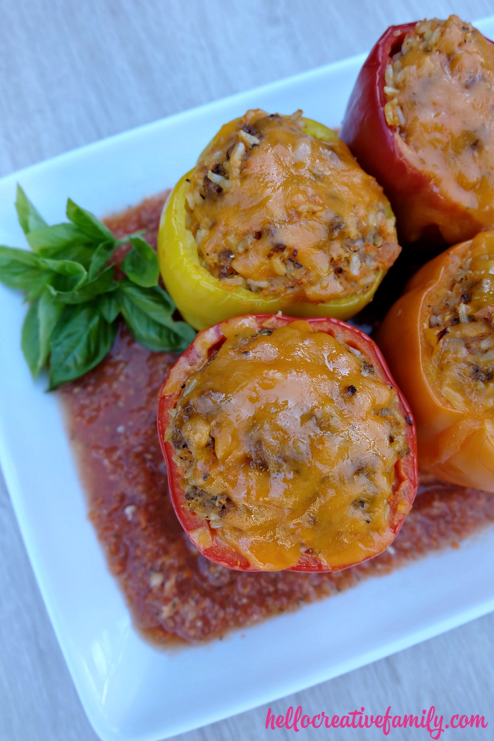 A quick and easy 30 minute weeknight meal idea! Italian Stuffed Bell Peppers Recipe with Rice, Ground Beef and Veggies! Parents will love it's packed full of hidden vegetables and kids will love the taste! 
