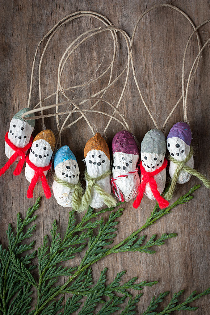 27+ DIY Christmas Ornaments Kids Can Craft- Painted Peanut Snowmen Ornaments from Evermine