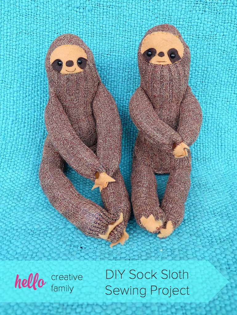 How sweet our these little DIY Sock Sloths? This would be the cutest handmade gift idea for a child or baby. Their hands have snaps so they can hang! DIY Sock Sloth Sewing Project on Hello Creative Family.