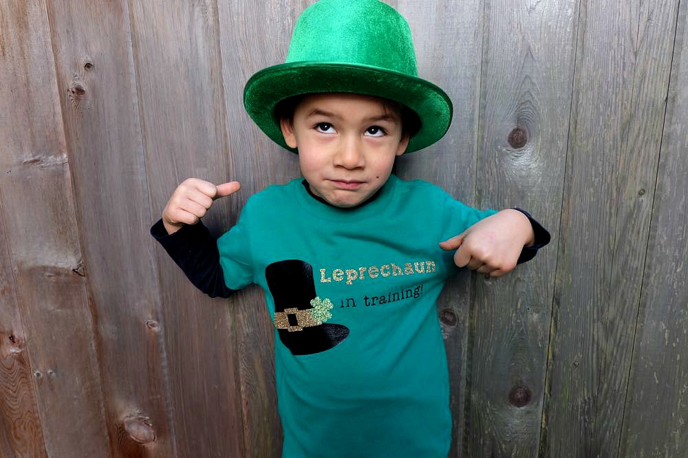 Your little leprechaun will be the cutest kid on the block with this DIY St. Patricks Day Shirt that says Leprechaun in Training. Has an easy step by step tutorial, instruction photos and free cut file for the Cricut. A great Cricut Project to make shirts for the whole family. 
