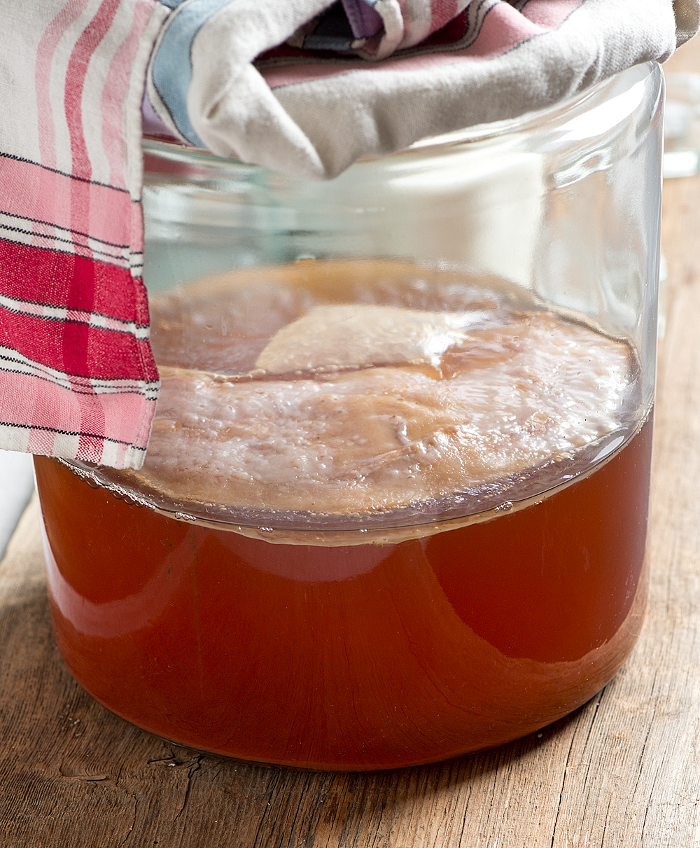Skip the store bought and brew your own kombucha right at home with these Easy Kombucha instructions for perfect tea every time. The step by step instructions with photos make it easy! 