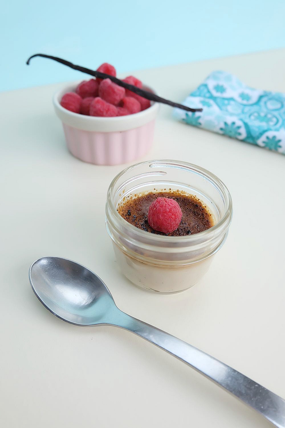 This Raspberry Crème Brûlée Recipe Made With Coconut Sugar is delicious and easy to make! The cream is infused with raspberries and vanilla beans. Topped with coconut sugar there are instructions on how to get the crunchy creme brulee top without using a kitchen torch! No special equipment required!