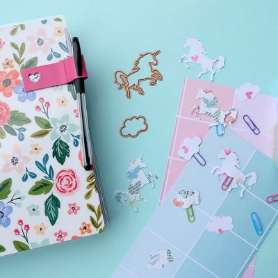 Make pretty unicorn and cloud clips using scrapbook paper and colorful paperclips! This craft project is so easy and perfect for marking the page of your Happy Planner or bullet journal or to use as a bookmark for your favorite novel! Super Simple DIY Unicorn Planner Bookmarks!