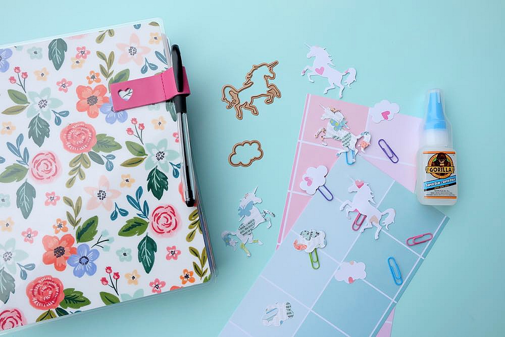 Make pretty unicorn and cloud clips using scrapbook paper and colorful paperclips! This craft project is so easy and perfect for marking the page of your Happy Planner or bullet journal or to use as a bookmark for your favorite novel! Super Simple DIY Unicorn Planner Bookmarks!