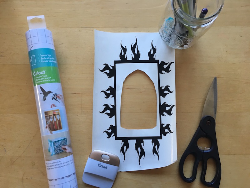Turn dollar store finds into DIY BBQ Gift Ideas For Dad with this amazing tutorial! Cut the designs with our Cricut Explore, then make a platter and container using vinyl and dishwasher safe mod podge or an apron with heat transfer vinyl. The design says Bad Ass BBQ Dad! Perfect for Father's Day or Christmas!