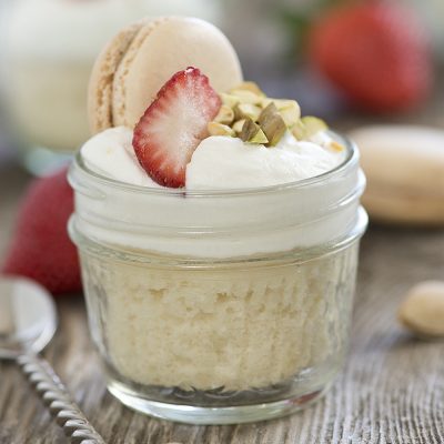 Mini desserts are incredibly easy & look gorgeous on any dessert table! This Mini Strawberry Shortcake Jars Recipe uses a doctored cake mix & fresh berries for an easy summertime dessert that's perfect for entertaining!