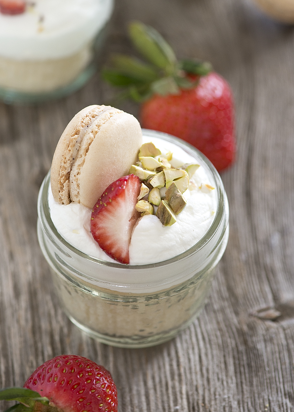 Mini desserts are incredibly easy & look gorgeous on any dessert table! This Mini Strawberry Shortcake Jars Recipe uses a doctored cake mix & fresh berries for an easy summertime dessert that's perfect for entertaining!