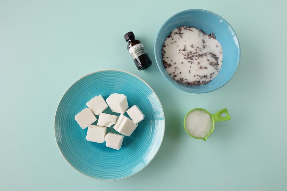 Making DIY body products at home is so much fun. Here is an easy project to get you started! These DIY Coconut Lavender Sugar Scrub Bars use shea butter melt and pour soap as their base. Perfect for exfoliating in the shower, or to use on feet and hands before a pedicure or manicure! Super simple to make and a fabulous handmade gift idea! 