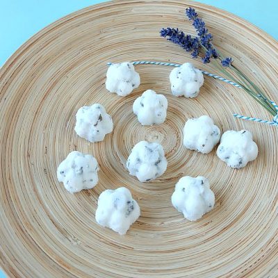 Making DIY body products at home is so much fun. Here is an easy project to get you started! These DIY Coconut Lavender Sugar Scrub Bars use shea butter melt and pour soap as their base. Perfect for exfoliating in the shower, or to use on feet and hands before a pedicure or manicure! Super simple to make and a fabulous handmade gift idea!