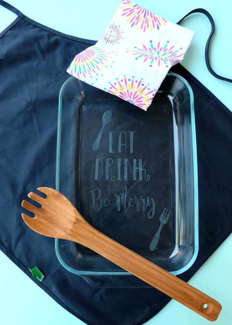 Making a gorgeous DIY Etched Glass Casserole Dish is so easy and makes a wonderful personalized handmade gift! Step by step photos are in this fun tutorial. A fun Cricut project that is perfect for wedding gifts, housewarming parties and entertaining guests! Includes a free cut file for the quote Eat, Drink, Be Merry!