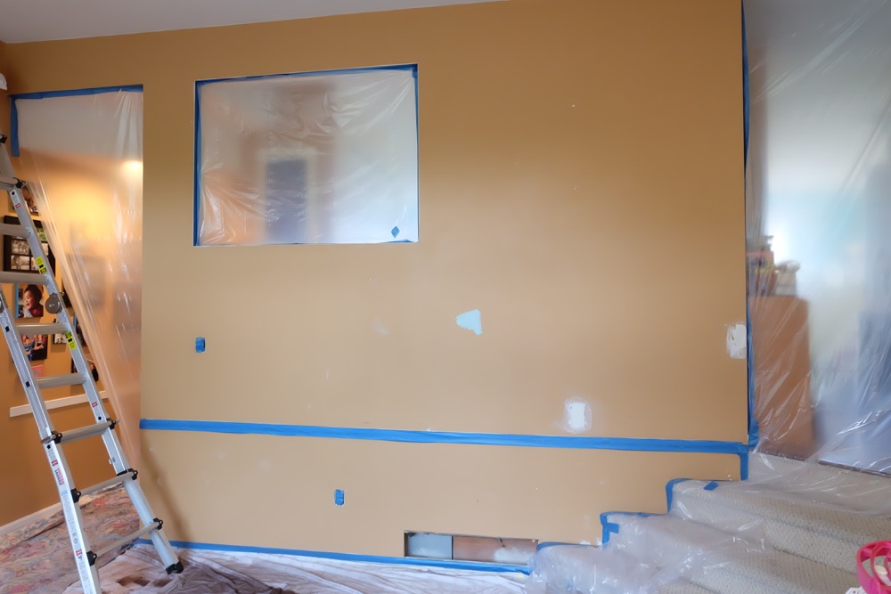 Take a sneak peek into behind the scenes of how Hello Creative Family transformed their tired old playroom into a gorgeous craft room video set! The craft table in this room is AMAZING. You will want to make your own craft room like this in your own house! #Sponsored by Wagner Paint Sprayers