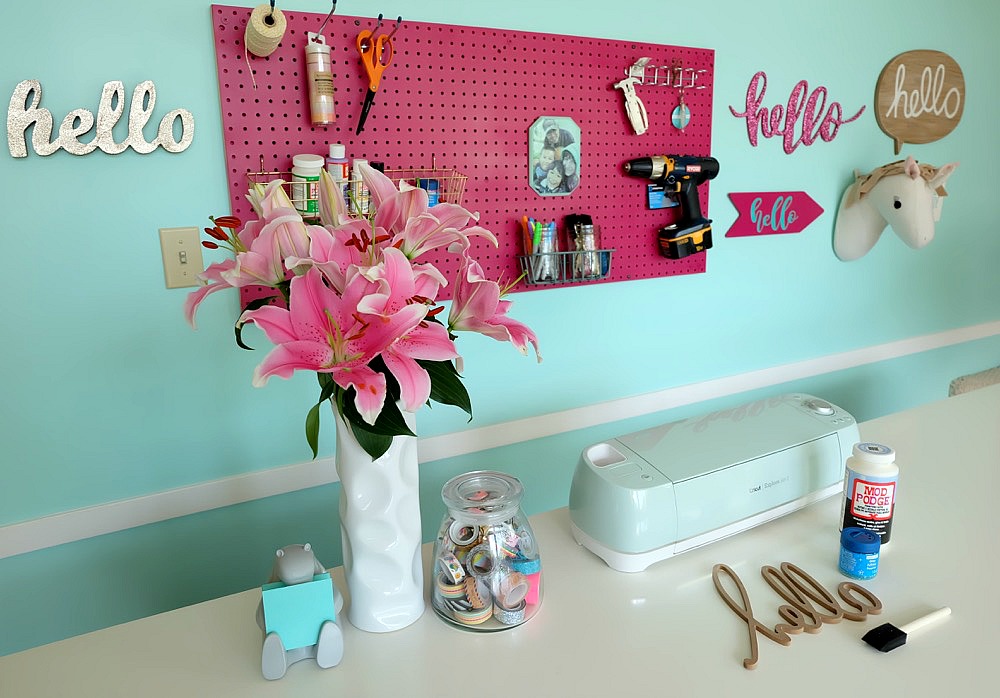 Take a sneak peek into behind the scenes of how Hello Creative Family transformed their tired old playroom into a gorgeous craft room video set! The craft table in this room is AMAZING. You will want to make your own craft room like this in your own house! #Sponsored by Wagner Paint Sprayers