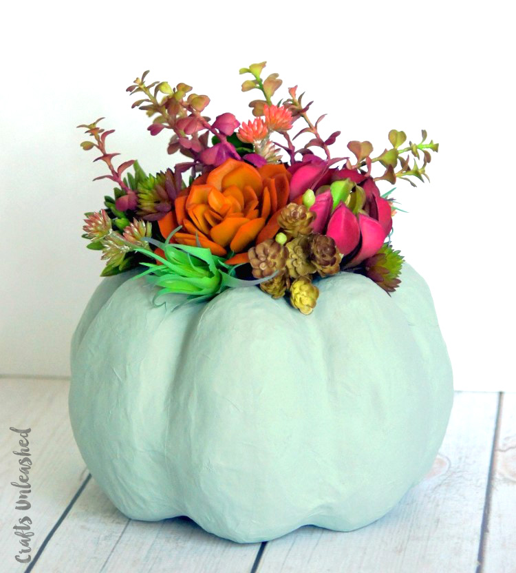 27+ Awesome Pumpkin Crafts, DIYs and Decorating Ideas- Faux Pumpkin Succulent Centrepiece from Consumer Crafts