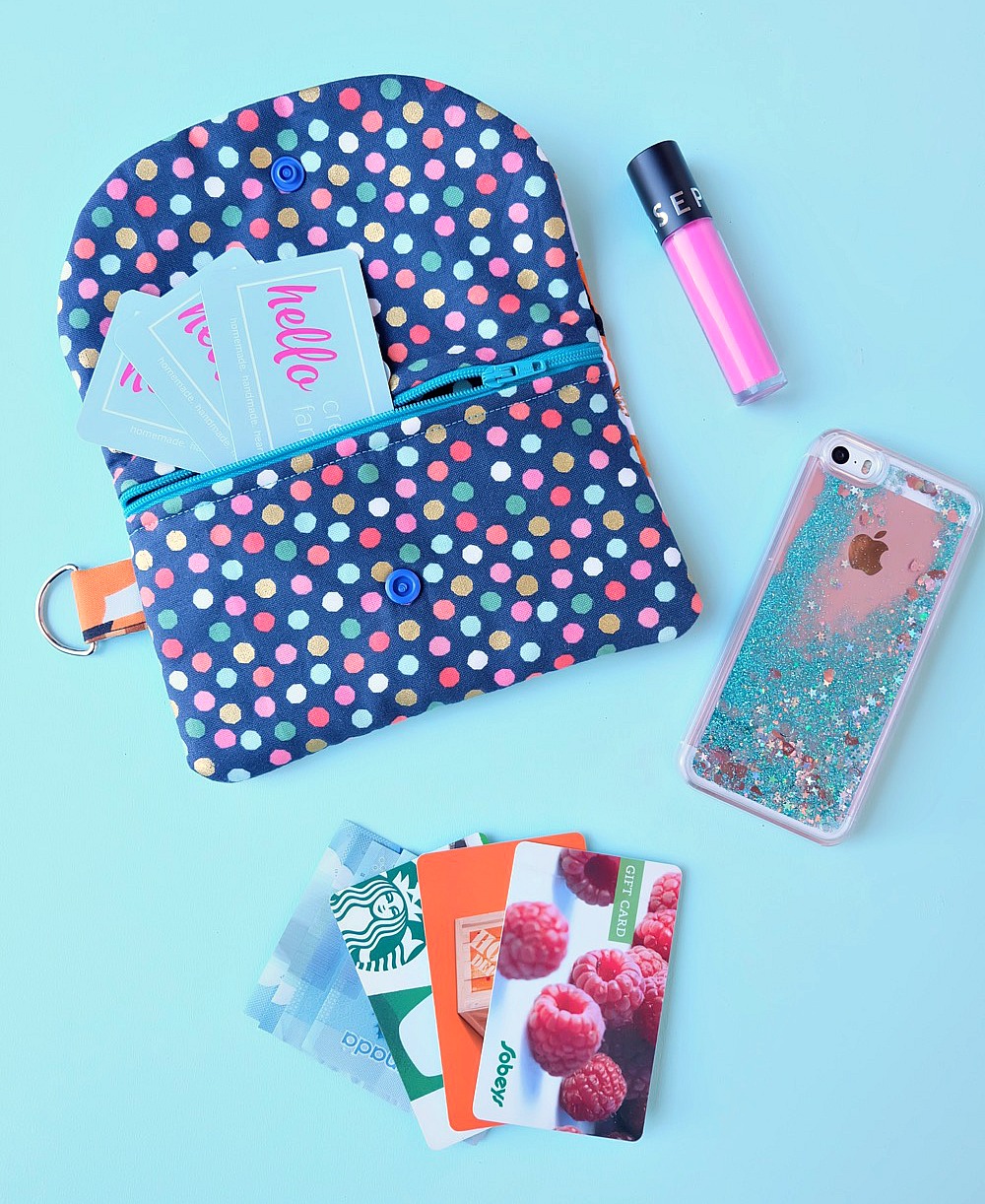 Looking for a cute little clutch to carry all your essentials? Check out this Essential Wallet Sewing Tutorial made using the Cricut Maker! This sweet little bag would make an adorable handmade gift! Perfect for teens and tweens. This project is #sponsored by Cricut. 