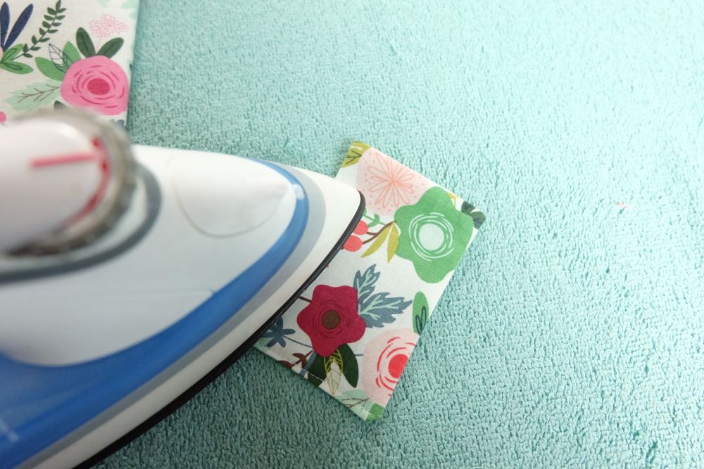 Know someone who loves to travel? This 30 minute DIY passport holder sewing tutorial makes a lovely handmade gift for anyone who has the travel bug! Customize it with your favorite fabric. The passport holder has a pocket to hold extra ID. This project tutorial has step by step photos making it so easy to make at home. Also comes with a free Cricut cut file for if you want to cut your fabric with the Cricut Maker. #sewing #craft #DIY #travel #cricutmaker