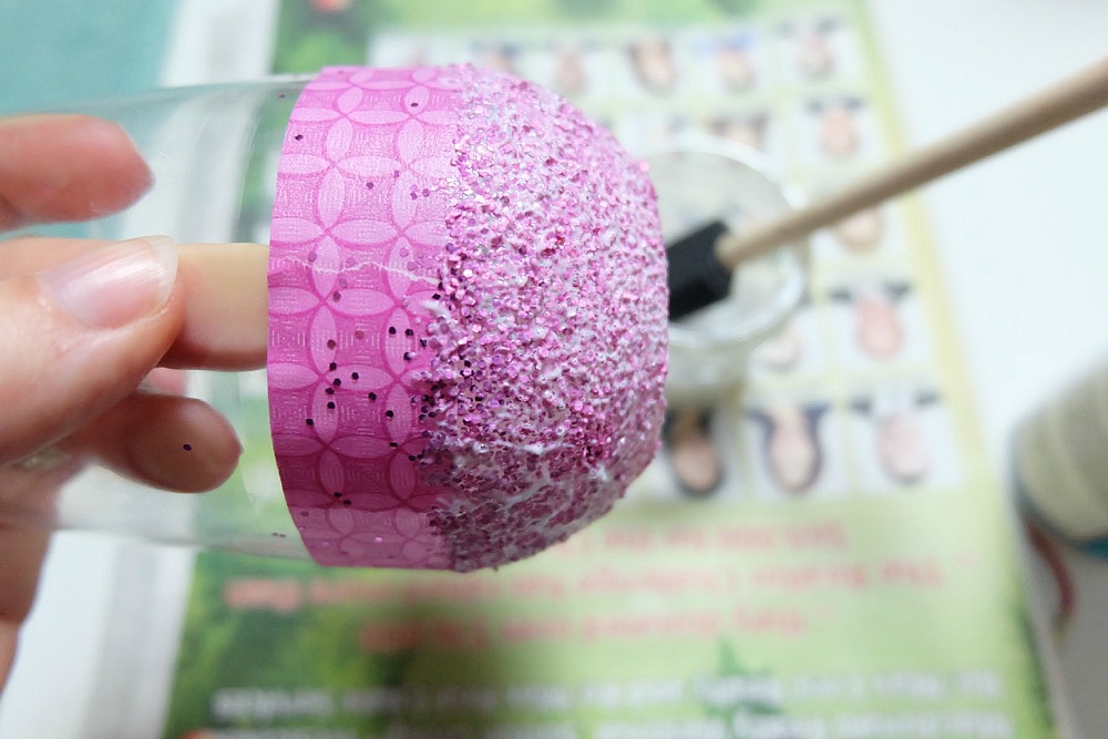 Celebrate Galentine's Day (aka Valentine's Day for with your BFF's) with these super cute DIY Glitter Dipped Wine Glasses. This post shares word art to make 6 different glasses along with an easy step by step tutorial with photos for how to make this project. This would be a great crafternoon project with friends! Use your Cricut to cut the word art. #CricutMade #Crafts #Galentine #DIY #Glitter #Valentine