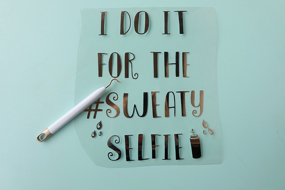 Having cute workout gear makes it even more fun to workout! Create this adorable DIY Workout Shirt that says "I do it for the #SweatySelfie" to keep you motivated at the gym! This post has a free cut file along with a step by step tutorial with photos for making this easy project using your Cricut! #CricutMade #Fitness #FitnessGear #Crafts #CricutProject