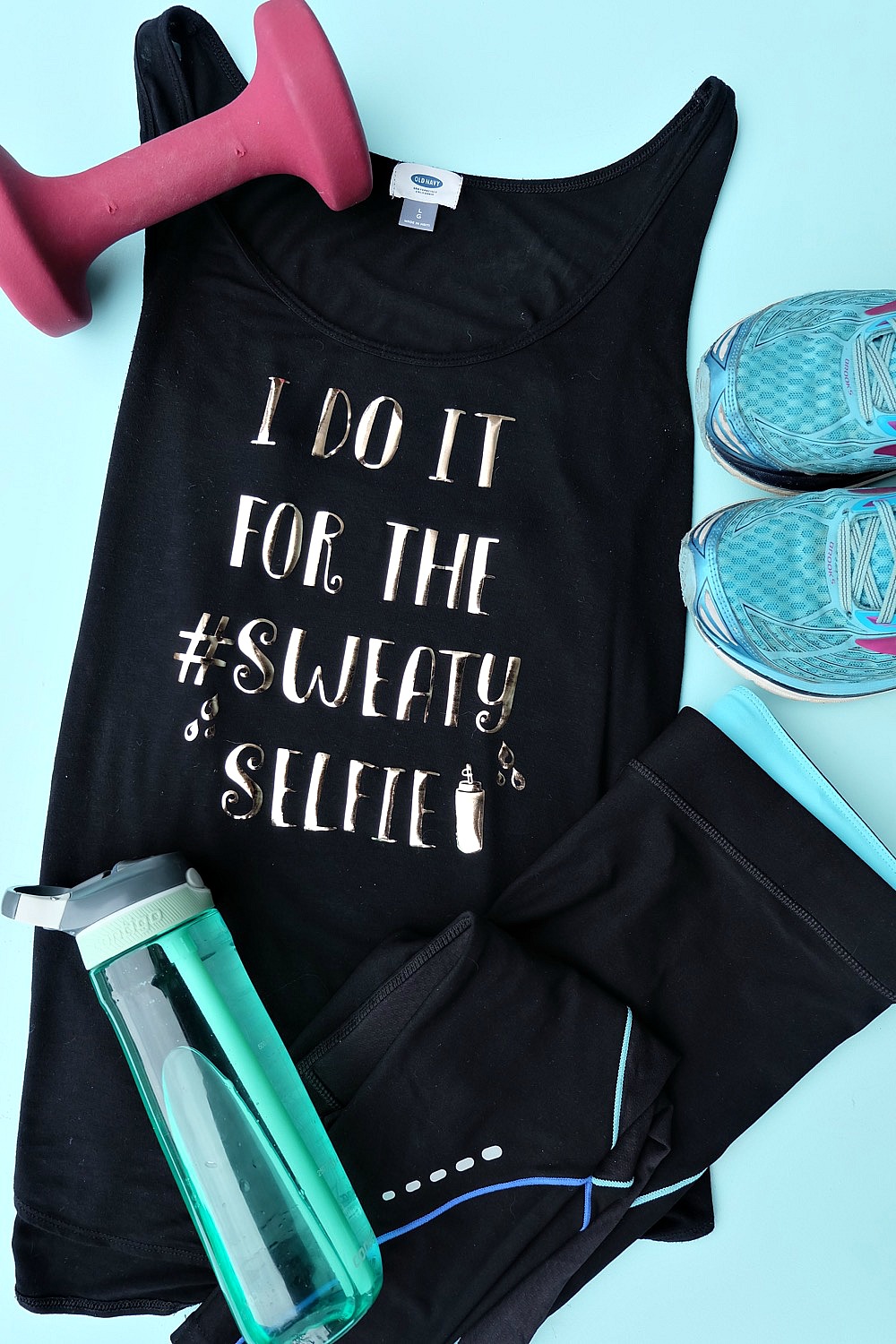 Having cute workout gear makes it even more fun to workout! Create this adorable DIY Workout Shirt that says "I do it for the #SweatySelfie" to keep you motivated at the gym! This post has a free cut file along with a step by step tutorial with photos for making this easy project using your Cricut! #CricutMade #Fitness #FitnessGear #Crafts #CricutProject
