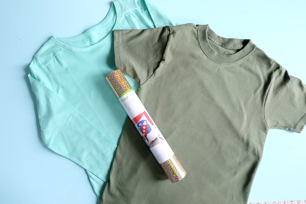 Celebrate St. Patrick's Day in style with this adorable DIY shamrock shirt! Make this project using your Cricut Maker or Cricut Explore. With this unique design one cut can make two shirts! Includes free cut file! A fun shirt for kids or adults! #cricutmade #cricutmaker #cricutholiday #KidsClothes