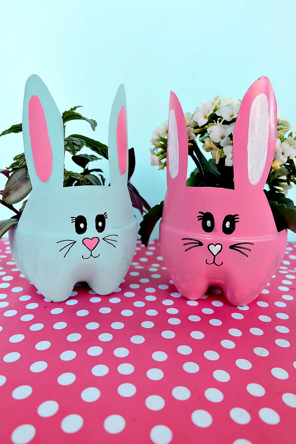 These DIY Easter Bunny Planters are made using recycled pop bottles! Bright and colorful they are a fun craft for a table centerpiece, front porch or handmade Easter gift idea! An easy upcycled kids Easter Craft to keep little ones occupied during spring break and to teach gardening skills. #Easter #Crafts #Upcycled HandmadeGift #Gardening