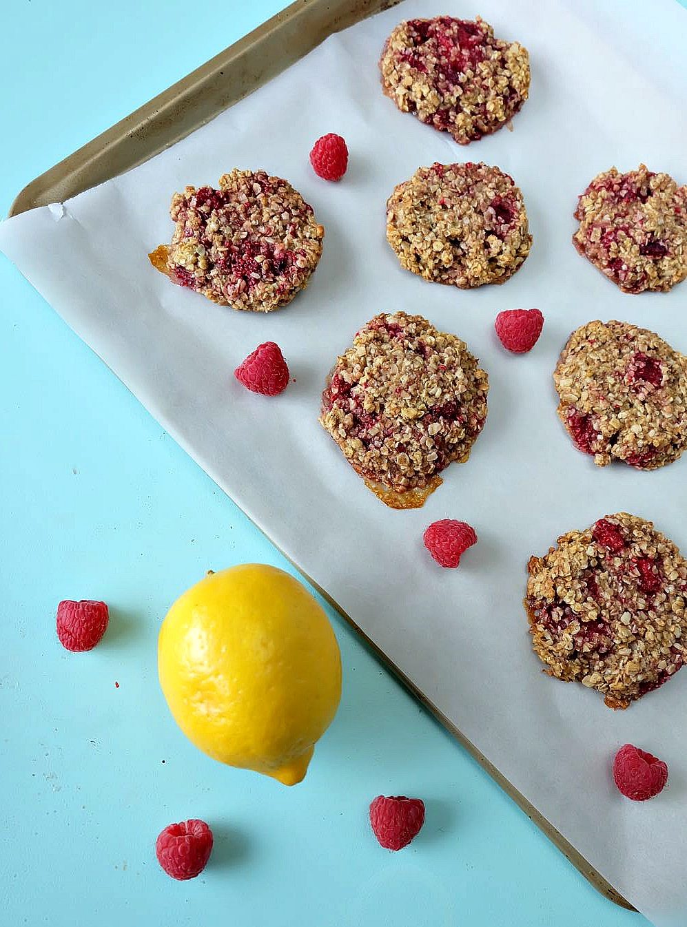Looking for a delicious, easy and healthy breakfast idea? This healthy lemon raspberry breakfast cookie recipe is a delicious and guilt free way to start the day! Perfect for breakfast on the go, its gluten free, low in sugar, dairy free and packed with the bright and beautiful flavors of lemon and raspberries! Freeze extras for breakfast meal planning!