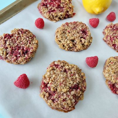 Looking for a delicious, easy and healthy breakfast idea? This healthy lemon raspberry breakfast cookie recipe is a delicious and guilt free way to start the day! Perfect for breakfast on the go, its gluten free, low in sugar, dairy free and packed with the bright and beautiful flavors of lemon and raspberries! Freeze extras for breakfast meal planning! #glutenfree #recipe #breakfast #cookie