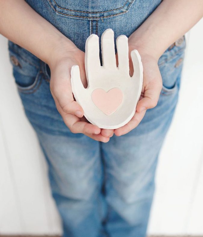 37+ Handmade Gift Ideas For Mom That She's Guaranteed To Love: DIY Child's Handprint Clay Jewelry Holder from Simple As That Blog