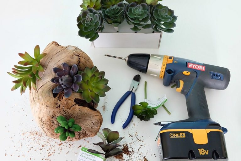 Create a beautiful DIY Faux Succulent Driftwood Planter with this easy step by step tutorial. Perfect for decorating a beach cottage, for centerpieces for an ocean themed wedding or party, or for a bit of pretty greenery in your home using driftwood you collected while beach combing. #DIY #Beach #Succulents