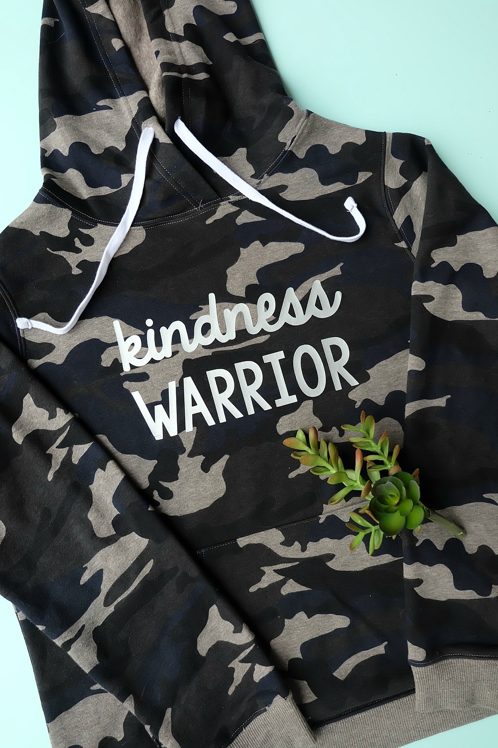 Spread kindness around the world! Let's create an army of kindness with this easy to make DIY Kindness Warrior Shirt. Includes step by step instructions on how to make this project using a Cricut, along with a free SVG cut file compatible with Cricut or Silhouette. The perfect hoodie for kids or adults to spread love instead of hate, discourage bullying and make the world a better place. #DIY #Cricut #Silhouette #SVG 
