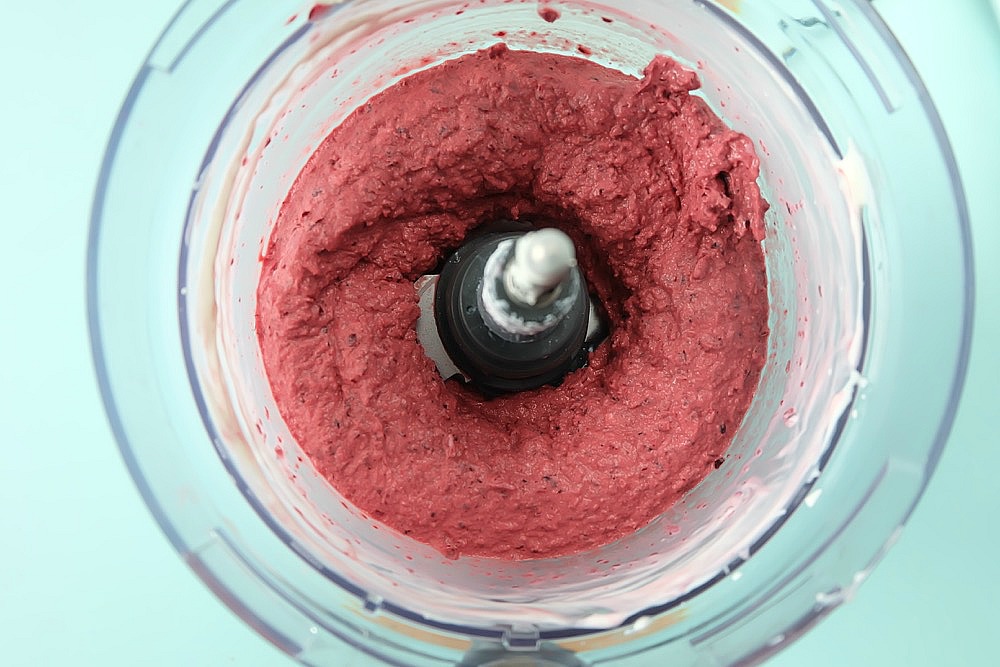 Easy to make and oh so delicious, this no churn healthy cherry vanilla frozen yogurt recipe is a family friendly favorite. This recipe can be made in 60 seconds or less with two simple ingredients. The perfect guilt free frozen summer treat! #dessert #recipe #icecream #healthyrecipe