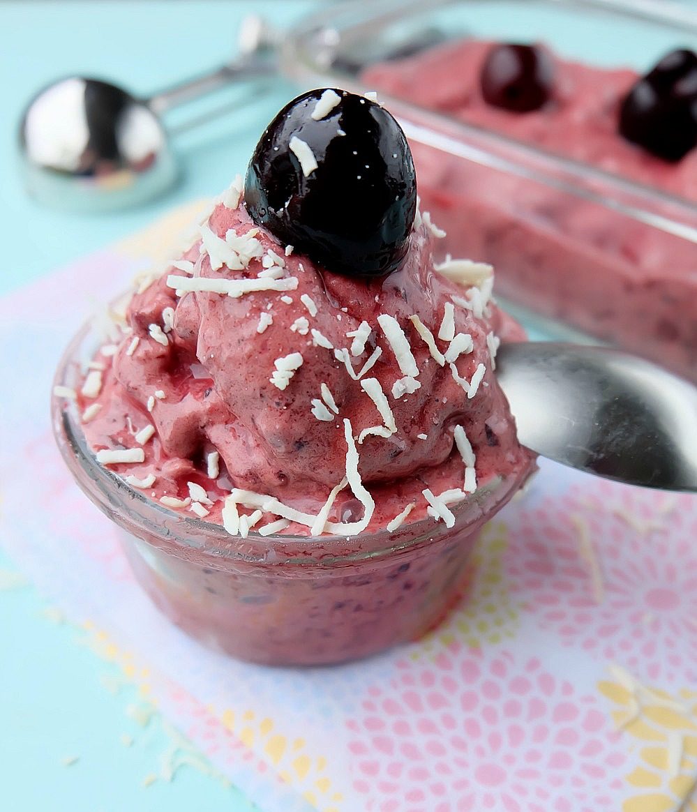 Easy to make and oh so delicious, this no churn healthy cherry vanilla frozen yogurt recipe is a family friendly favorite. This recipe can be made in 60 seconds or less with two simple ingredients. The perfect guilt free frozen summer treat! #dessert #recipe #icecream #healthyrecipe