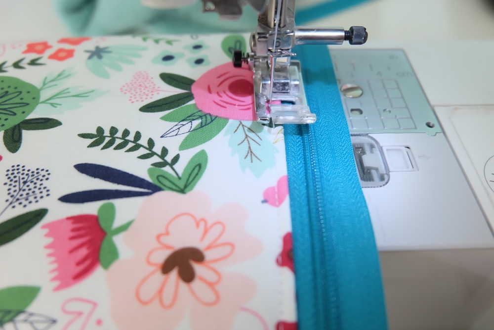 Every girl needs the perfect clutch, so why not make them! This easy sewing tutorial has step by step photos and instructions for making a DIY Wristlet Clutch Purse. Fit all of your essentials into this one little bag! Comes with a free cut file for making this craft project on the Cricut Maker. #Cricut #CricutMade #sewing #crafts