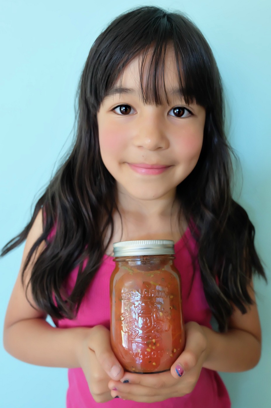 Get canning with your family this summer! We're sharing our top tips for canning with kids along with step by step photos and instructions for how to make our Easy Italian Herb Canned Tomatoes Recipe! We take all the intimidation out of canning so you can pass this handmade art along to your kids! #Canning #Recipe #Tomatoes #KidsCooking
