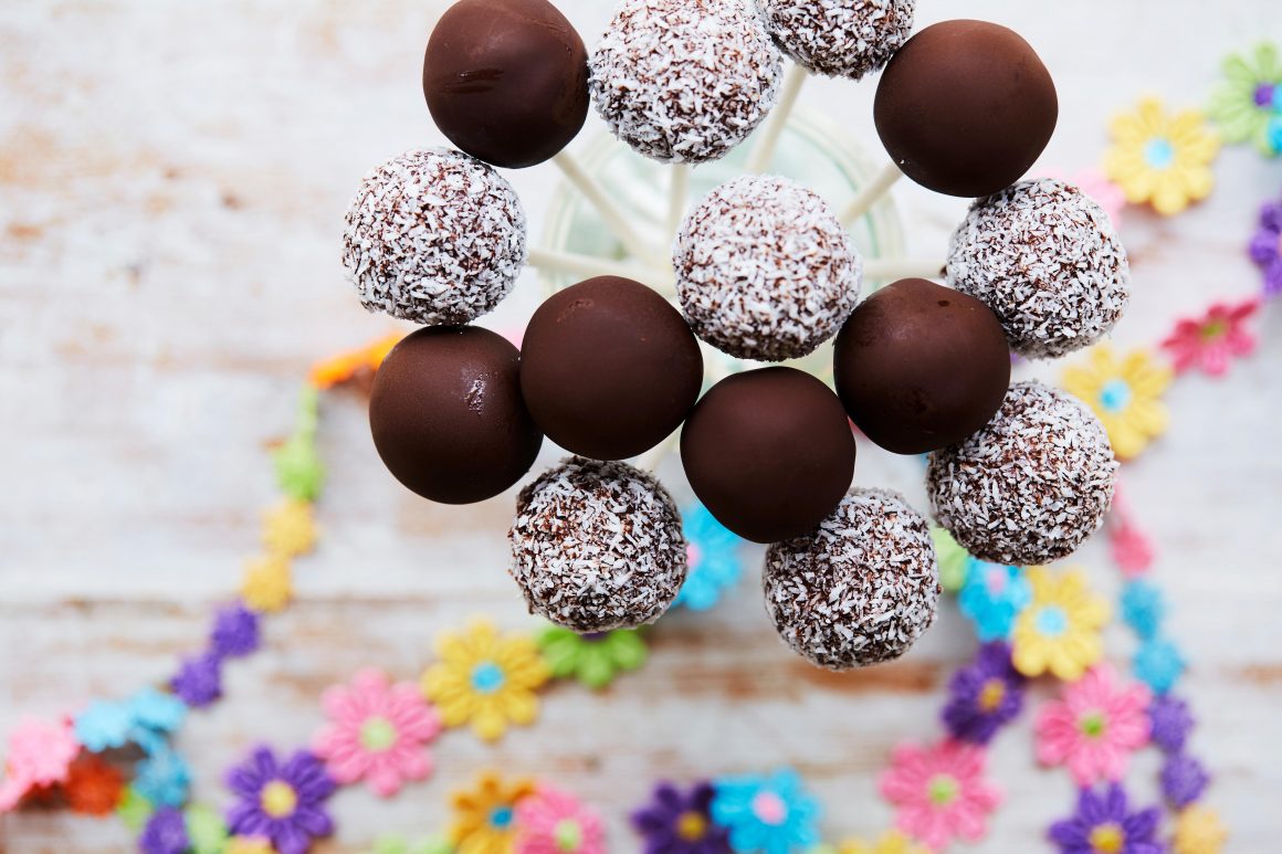 Looking for a delicious, nutritious, guilt free dessert idea? This Chocolate Chia Bliss Ball Pops Recipe is vegan, gluten-free and nut free! It's perfect for an easy, healthy birthday dessert idea and would be perfect for a nut-free school snack or treat! Recipe from the book The Wholesome Child. #Dessert #Recipe #GlutenFree #RealFood