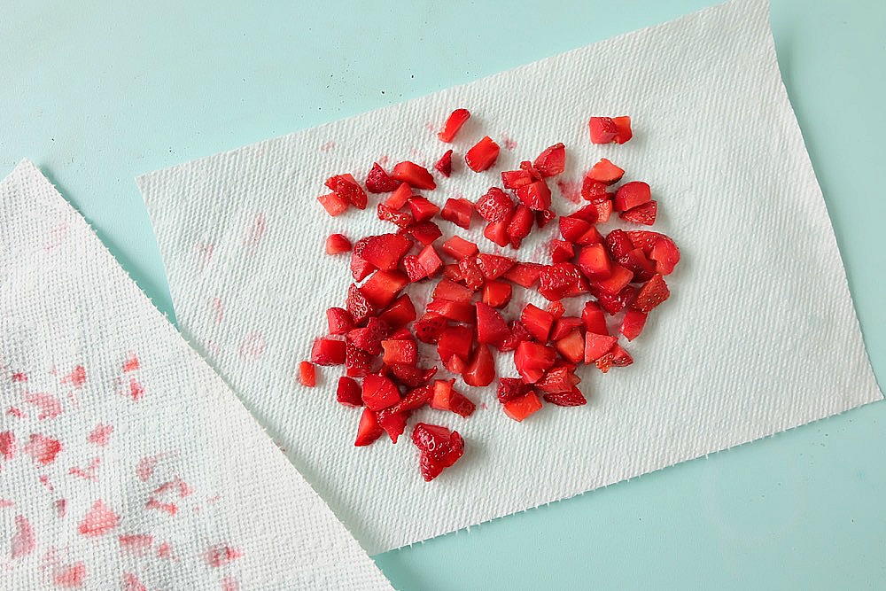 Strawberries, rhubarb, coconut and frothy egg whites come together in one delicious dessert in this Strawberry Rhubarb Coconut Meringue Cookie Recipe. These pretty cookies are perfect for a summer tea party and are simple to make. Sure to become a family favorite! #cookies #recipe #strawberry #rhubarb #strawberryrhubarb