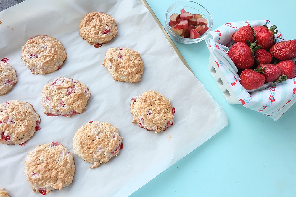 Strawberries, rhubarb, coconut and frothy egg whites come together in one delicious dessert in this Strawberry Rhubarb Coconut Meringue Cookie Recipe. These pretty cookies are perfect for a summer tea party and are simple to make. Sure to become a family favorite! #cookies #recipe #strawberry #rhubarb #strawberryrhubarb