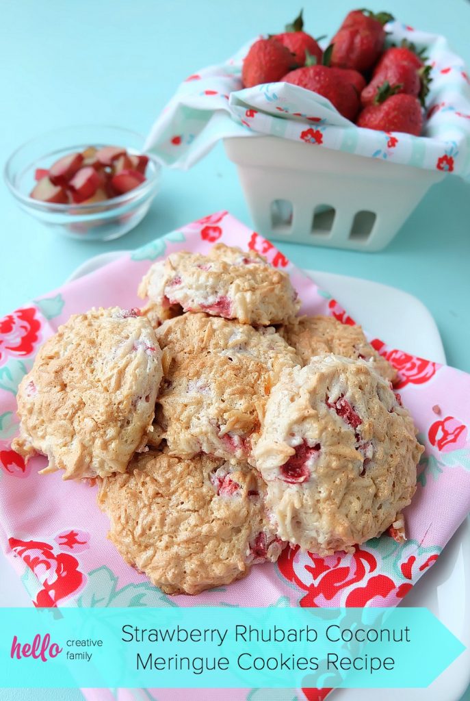 Strawberries, rhubarb, coconut and frothy egg whites come together in one delicious dessert in this Strawberry Rhubarb Coconut Meringue Cookie Recipe. These pretty cookies are perfect for a summer tea party and are simple to make. Sure to become a family favorite! #cookies #recipe #strawberry #rhubarb #strawberryrhubarb