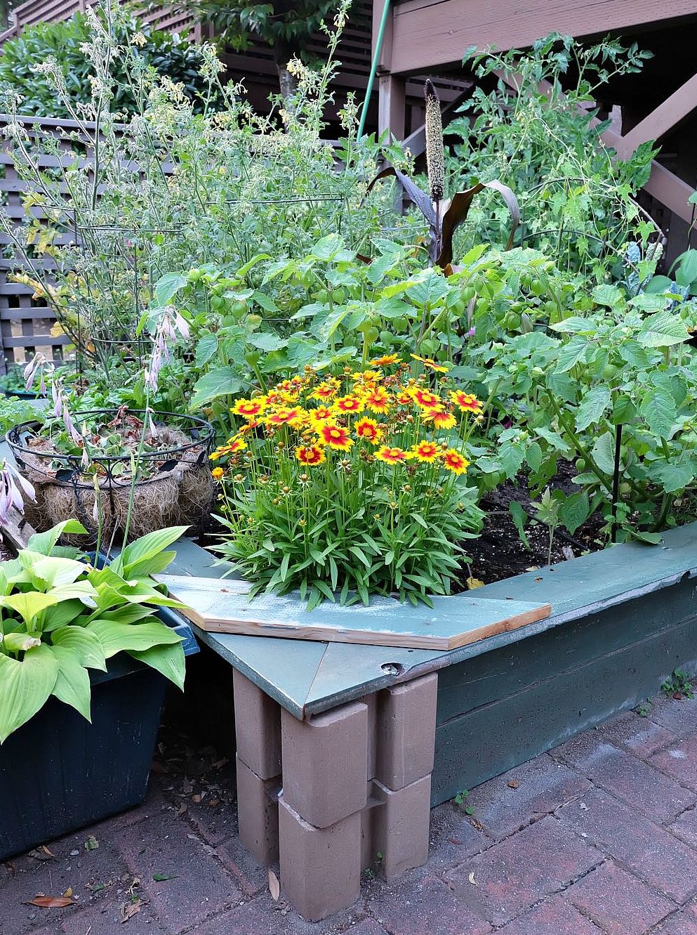 Expand your patio garden or backyard garden with this easy DIY planter box from Hello Creative Family. No power tools required, this planter box can be made in an hour or less in a small space, large space or any size in between. Includes step by step instructions. #Gardening #PatioGardening #SmallSpaceGardening #DIY