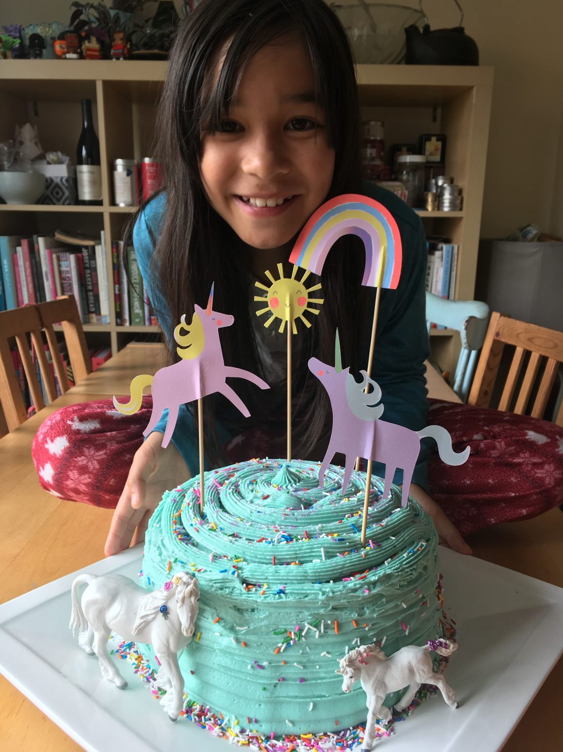Simple unicorn birthday cake with a rainbow hidden inside. 