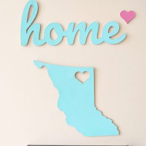 Have you used your Cricut Maker to cut chipboard yet? What are you waiting for? It's amazing and easy! Learn tips for cutting chipboard with the Cricut Maker, how to make a gorgeous DIY Chipboard Home sign for a handmade accent piece on your photo wall and grab our free Home SVG which you can cut with a Cricut or Silhouette. This would also make the cutest handmade housewarming gift! #SVG #FreeSVG #CricutMaker #DIY