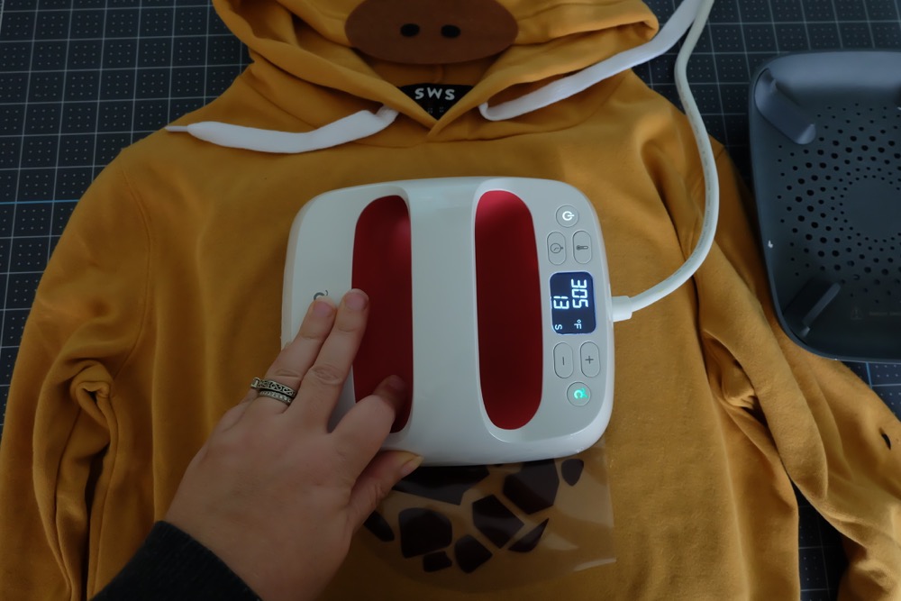 Looking for a fun idea for DIY No Sew Group Halloween Costumes? Look now further! We used HTV, felt a glue gun and our Cricut Maker to create these adorable zoo animal hoodies. We've got free cut files for a giraffe, parrot and panda! Make all three for a fun group halloween costume for kids or adults! A quick and easy Halloween Costume Idea that will take less than 30 minutes to make. #Halloween #DIY #GroupCostume #CricutMaker #Cricut #CricutMade #Sponsored