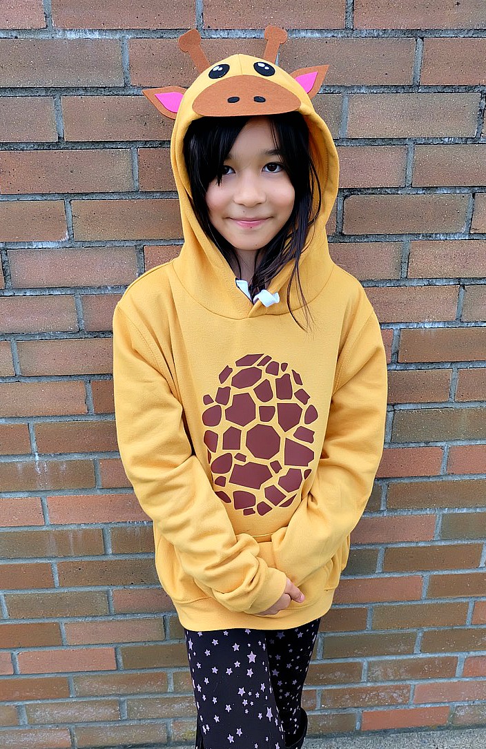 Looking for a fun idea for DIY No Sew Group Halloween Costumes? Look no further! We used HTV, felt a glue gun and our Cricut Maker to create these adorable zoo animal hoodies. We've got free cut files for a giraffe, parrot and panda! Make all three for a fun group halloween costume for kids or adults! A quick and easy Halloween Costume Idea that will take less than 30 minutes to make. #Halloween #DIY #GroupCostume #CricutMaker #Cricut #CricutMade #Sponsored