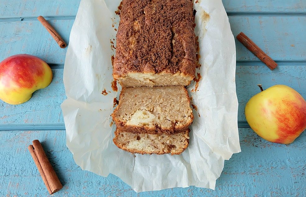 This cinnamon apple bread recipe is a family favorite that is perfect for breakfast or a to serve for afternoon tea! Kid friendly, the apples melt right into the bread. Topped with a crunchy cinnamon and brown sugar topping. Easy to make with just 10 minutes of prep time, you're going to love baking this apple recipe! #Baking #Bread #Apples #Recipe